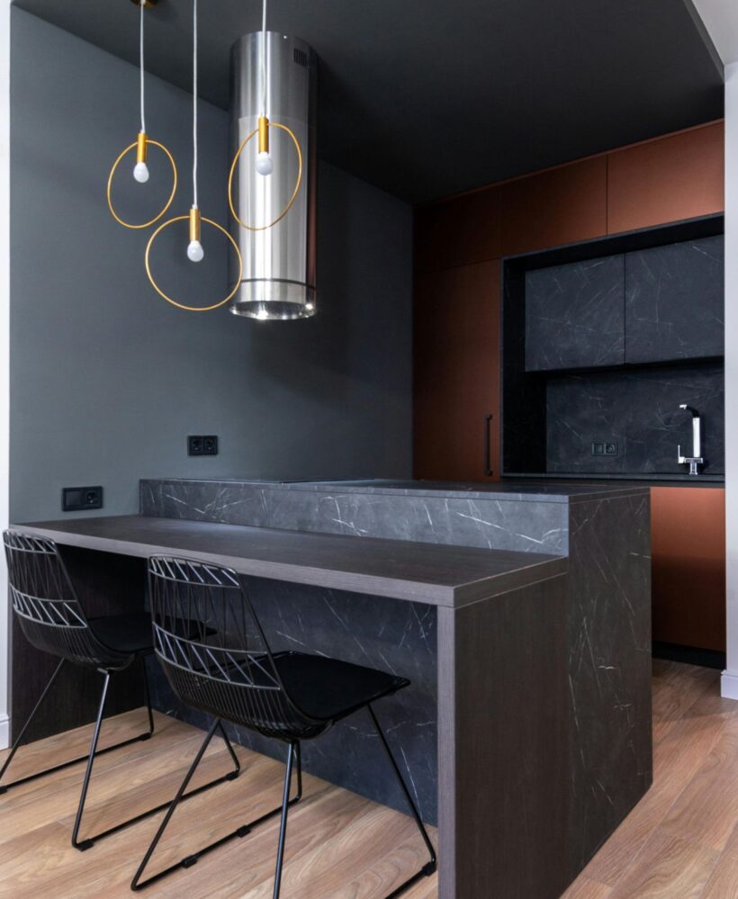 Modern kitchen design in black marble color photo